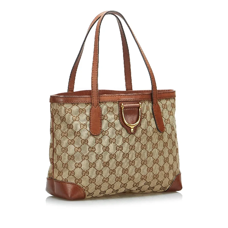 Ladies Gucci shoulder bags with a magnetic - closure flapGucci GG Canvas Stirrup Handbag (SHG-4H8XJO)