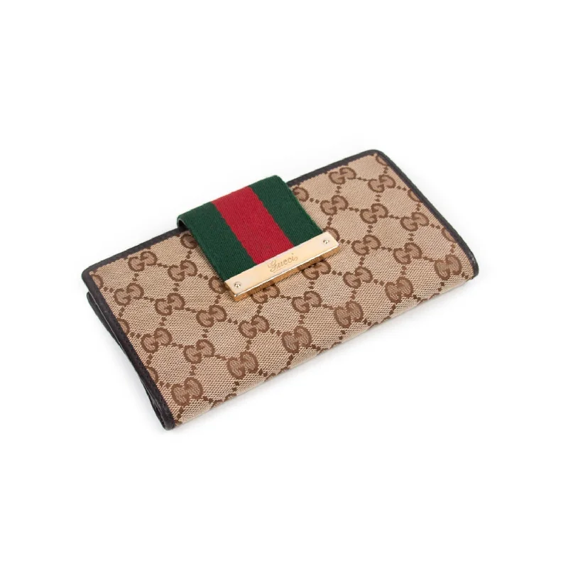 Women Gucci bags with a snap - button closure and a decorative charmGucci Web GG Continental Wallet