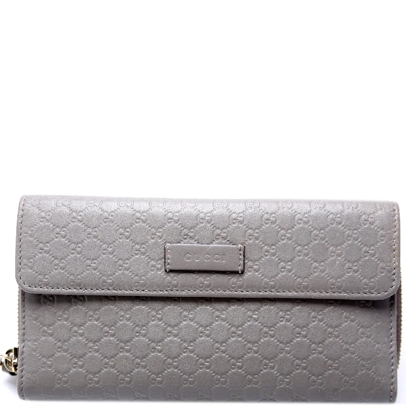 Women Gucci bags with a snap - button closure and a decorative charmMicro Guccissima Long Wallet