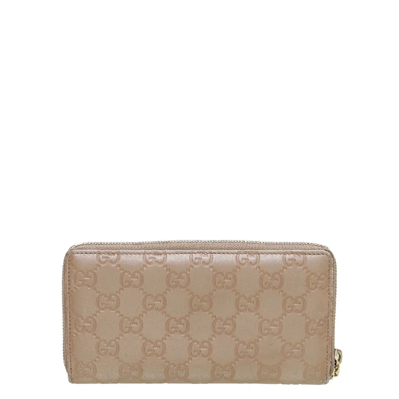 Women Gucci Sylvie bags featuring the signature web stripeGucci Rose Beige GG Guccissima Zip Around Lovely Wallet