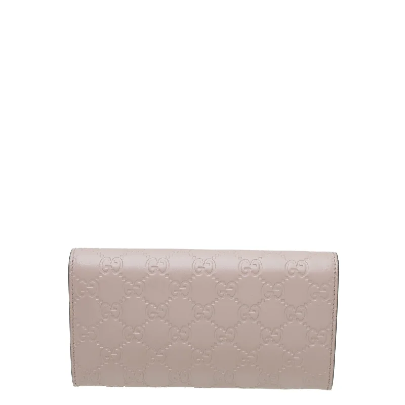 Gucci Marmont bags for women with a contrast - colored interiorGucci Baby Pink GG Guccissima Bow Continental Wallet