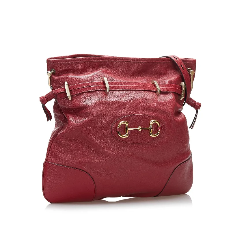 Women Gucci crossbody bags in a bold red colorGucci Horsebit 1955 Drawstring Crossbody Bag (SHG-Xwa7rJ)