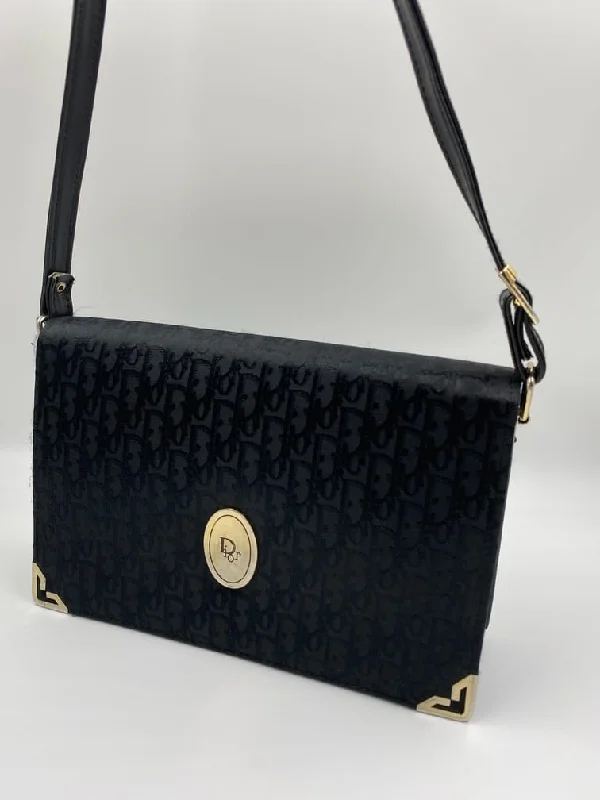 Christian Dior Saddle bags with a studded trim for a bold lookVintage Christian Dior logo Bag